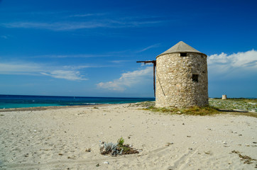 Fototapeta na wymiar windmill in lefkada island ai giannis beach summer in greece
