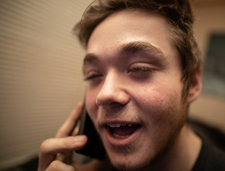 Obraz premium teenager is caught talking on a cellphone while in class