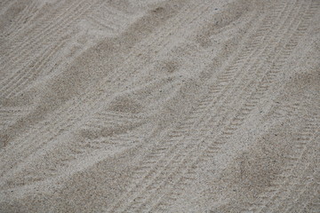 Fototapeta na wymiar Tracks on sand