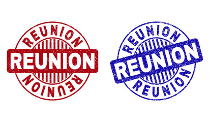 Grunge REUNION round stamp seals isolated on a white background. Round seals with grunge texture in red and blue colors. Vector rubber overlay of REUNION tag inside circle form with stripes.