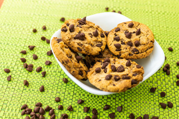 Cookies with chocolate chips on white plate