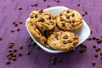 Cookies with chocolate chips on white plate