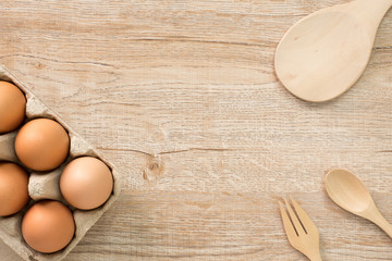 Eggs for cooking on wood background top view.Flat lay.