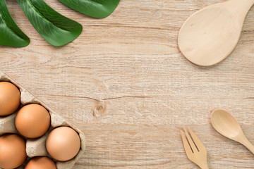 Eggs for cooking on wood background top view.Flat lay.