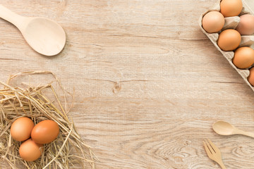 Eggs for cooking on wood background top view.Flat lay.
