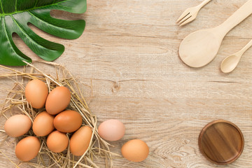 Eggs for cooking on wood background top view.Flat lay.