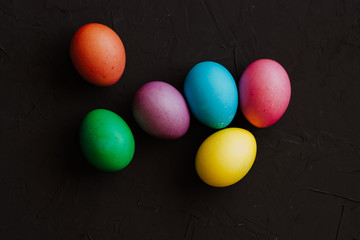 Colored easter eggs on a black background