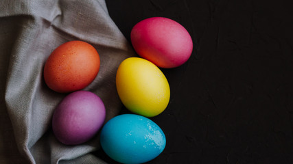 Colored easter eggs on a black background