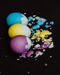 Colored easter eggs on a black background