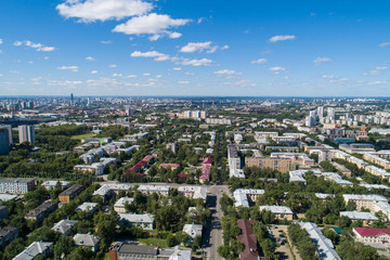 Fototapeta premium Top down aerial drone image of a Ekaterinburg city in the midst of summer, backyard turf grass and trees lush green.