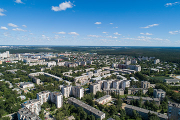 Top down aerial drone image of a Ekaterinburg city in the midst of summer, backyard turf grass and trees lush green.