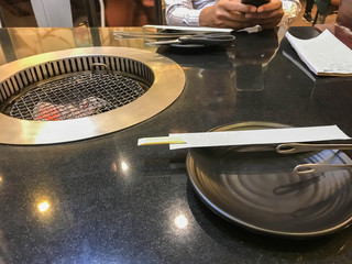 close up dish and chopsticks in BBQ Japanese restaurant