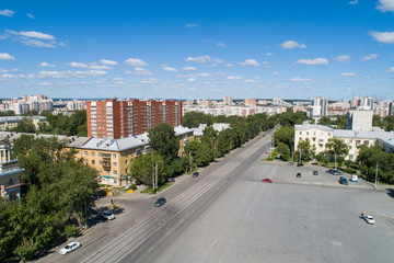 Top down aerial drone image of a Ekaterinburg city in the midst of summer, backyard turf grass and trees lush green.