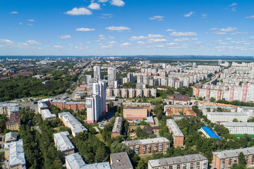Fototapeta premium Top down aerial drone image of a Ekaterinburg city in the midst of summer, backyard turf grass and trees lush green.