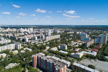Fototapeta na wymiar Top down aerial drone image of a Ekaterinburg city in the midst of summer, backyard turf grass and trees lush green.