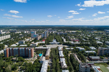 Top down aerial drone image of a Ekaterinburg city and house of culture with square in the midst of summer, backyard turf grass and trees lush green.