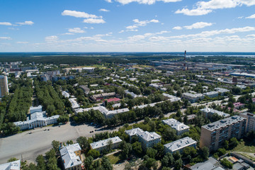 Top down aerial drone image of a Ekaterinburg city and house of culture with square in the midst of summer, backyard turf grass and trees lush green.