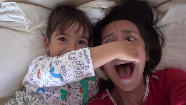 4K Selfie son drags away his mothers nose in the bed