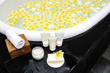 Bath with yellow flowers in tropics.