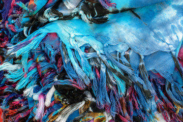 Colorful summer clothes for sale in local street market in Thailand, close up