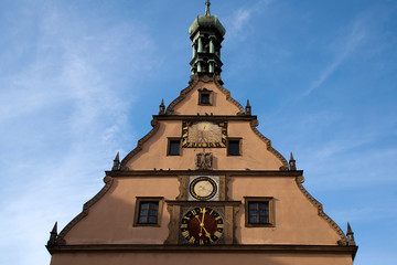 Fototapeta na wymiar Rothenburg ob der Tauber Germany, Ratstrinkstube facade with clock, date, coat of arms and sun dial