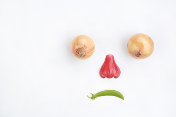 Sad face looking down of fresh fruit and vegetables isolated on a white background with copy space.