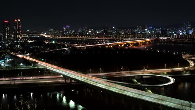 The night view of Seoul. Time lapse expressway top view.