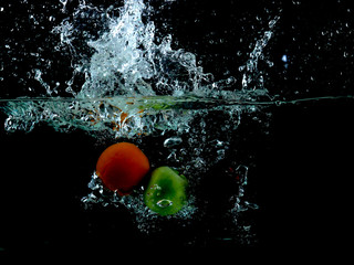 Splashing fruit into water.