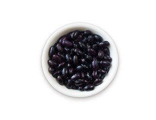Kidney beans soaked in water in a bowl on a white background. Beans isolated on white background. Black beans soaked in water. Black kidney in a bowl isolated on white.