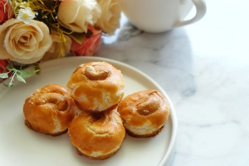 Close up of Singapore cookie on white plate.