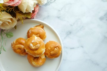 Close up of Singapore cookie on white plate.