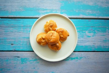 Close up of Singapore cookie on white plate.