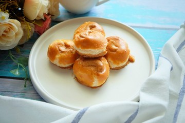 Close up of Singapore cookie on white plate.