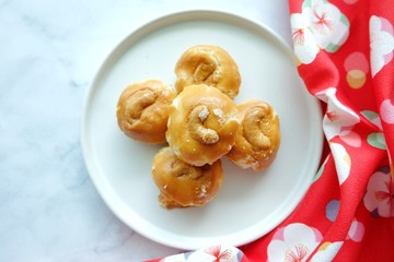 Close up of Singapore cookie on white plate.