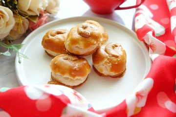 Close up of Singapore cookie on white plate.