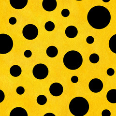 Hand painted seamless watercolor pattern with chaotic tossed black circles of different sizes. Abstract illustration on yellow textured background