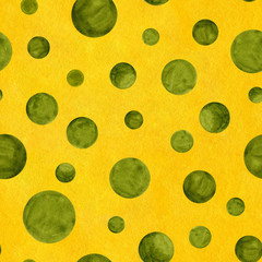 Hand painted seamless watercolor pattern with chaotic tossed olive green circles of different sizes. Abstract geometric illustration on yellow textured background
