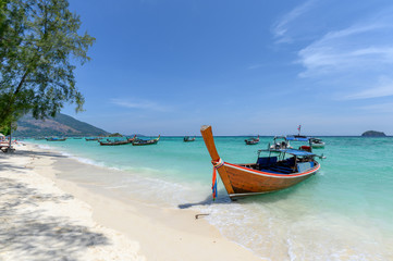 Beautiful crystal tropical sea with wooden boat at lipe
