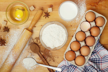 Food ingredients for baking: flour, eggs, milk, sugar	