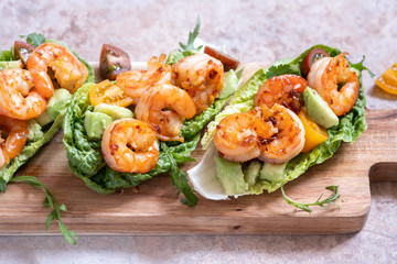 Lettuce wrapped Shrimp tacos with fresh tomato and avocado