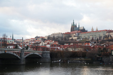 The panorama of the Charles bridge and Prazhsky Hrad in the center of Prague