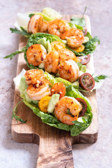 Lettuce wrapped Shrimp tacos with fresh tomato and avocado