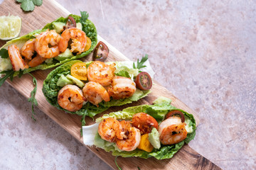 Lettuce wrapped Shrimp tacos with fresh tomato and avocado