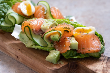 Lettuce wrapped smoked salmon tacos with fresh cucumber, avocado and eggs