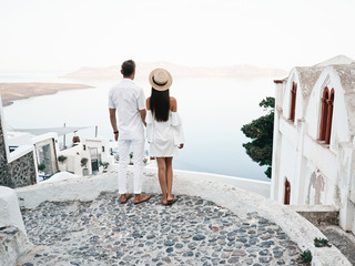 Fototapeta na wymiar Happy young couple on Santorini