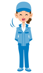 頷くベージュの作業着の女性