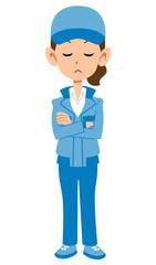 考えるブルーの作業着の女性