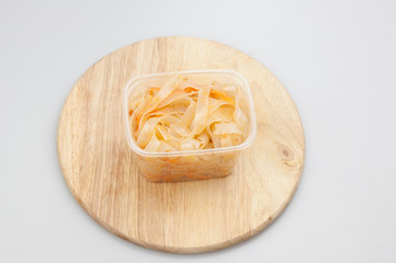 Funchoza salad with rice noodles on white. Copy space