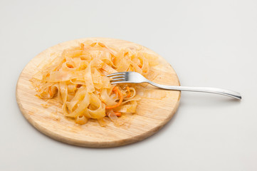 Funchoza salad with rice noodles on white. Copy space