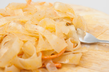 Funchoza salad with rice noodles on white. Copy space